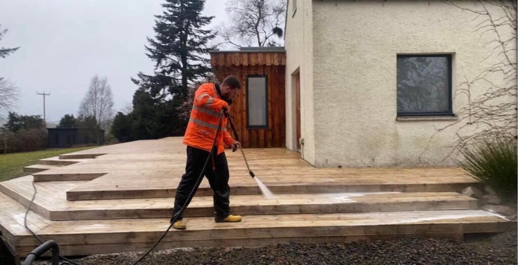 photo of us cleaning decking